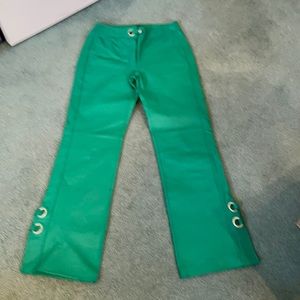 Fashionable leather green pants.